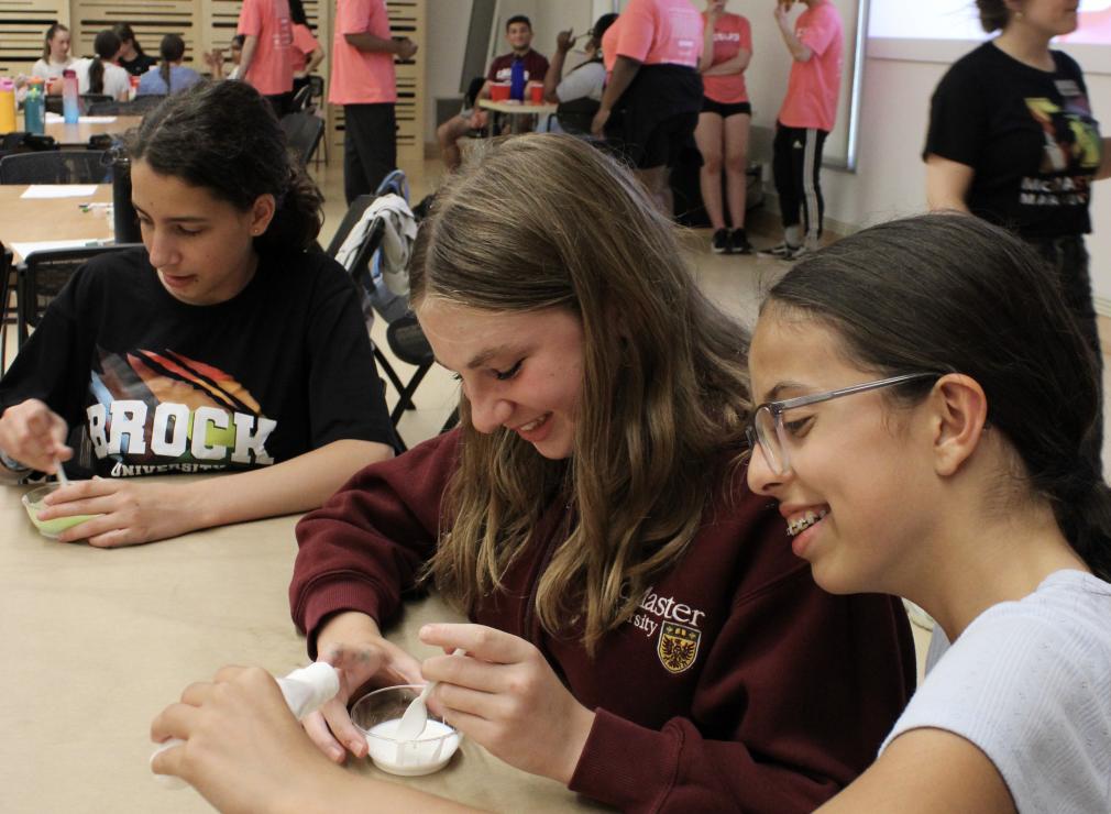 students in a classroom working on a science project